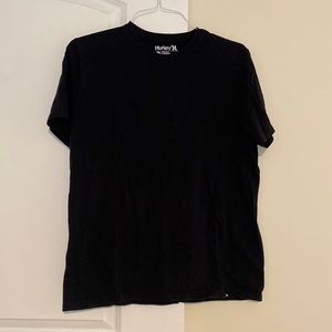 Plain black Hurley tee with front pocket. Size large.